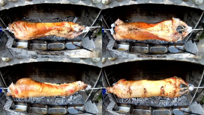 一家餐馆的厨师准备了一只开胃的烤羊肉，上面吐着脆皮。腿羊肉/煎肉，加酱汁。多汁的肉类食品。着火的肉