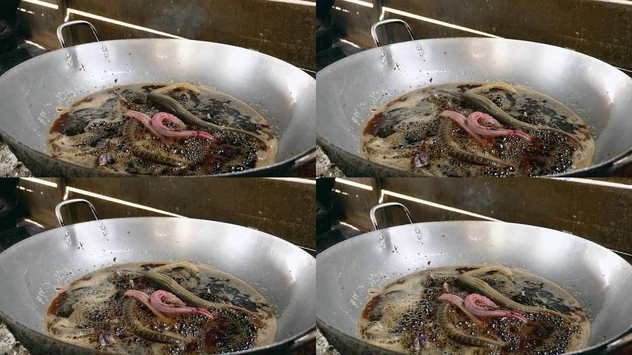 炒锅中的油炸蛇特写
