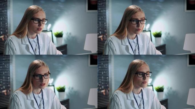 女性心理学家在眼镜和实验服上的特写镜头与患者进行视频通话