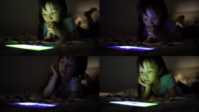 可爱的台湾女孩睡觉前用平板电脑