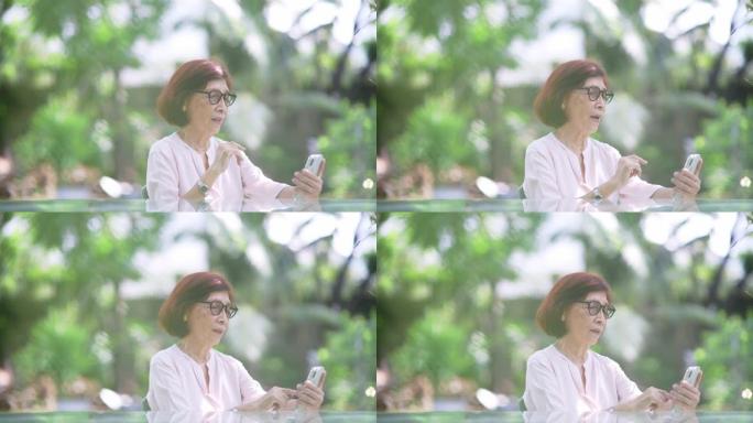 使用智能手机进行视频通话的退休妇女