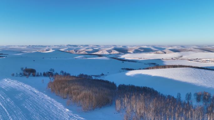 航拍雪域雪原山峦暮色