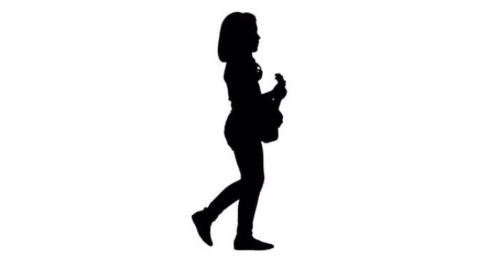 剪影一个小女孩手里拿着夏威夷四弦琴走路
