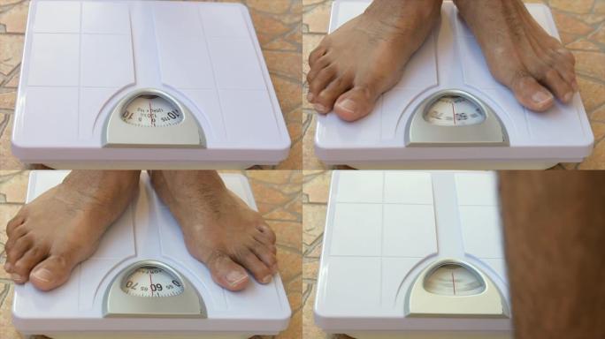 近距离站立在体重秤上的人的脚，以测量体重减轻。体重秤达到健康减肥的概念。