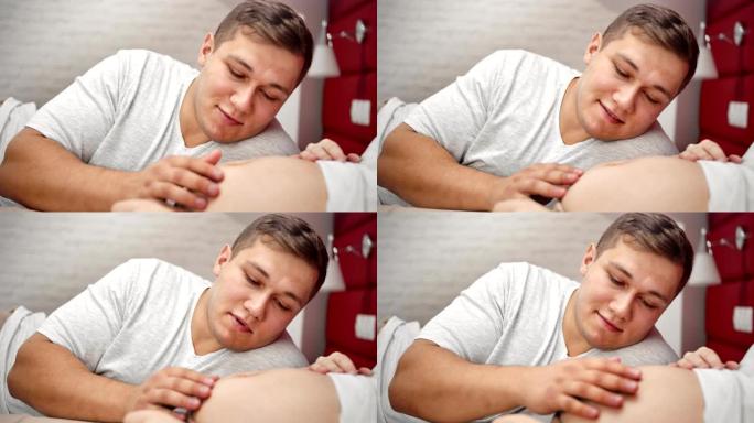 幸福欧洲年轻人未来父亲享受触摸大女性怀孕肚子