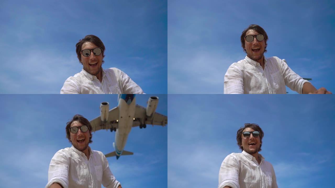 一个快乐的游客在热带海滩上玩得开心的超级镜头，一架飞机飞过他