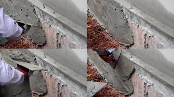 脚步慢动作: 建筑工人修整一堵墙