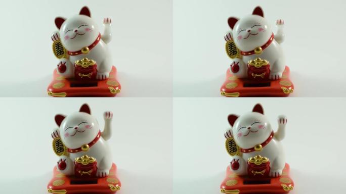 受欢迎的猫角色Maneki Neko挥舞着爪子，吸引买家。视频订阅