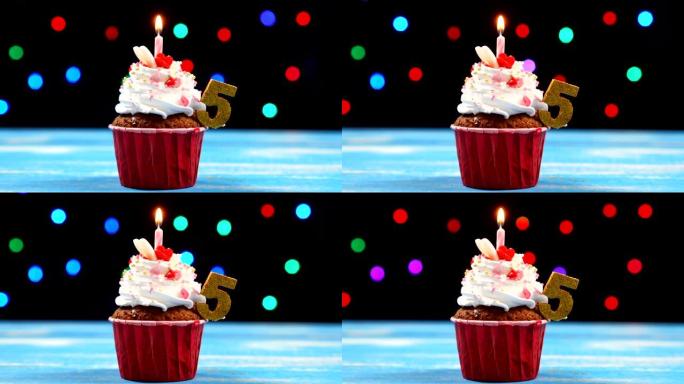 美味的生日蛋糕，蜡烛燃烧，五色模糊灯光背景上有5号