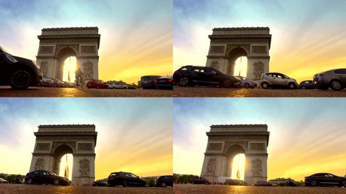 日落时分三圈交通的低角度视图。这座历史古迹俯瞰法国首都中心的香榭丽舍大道。