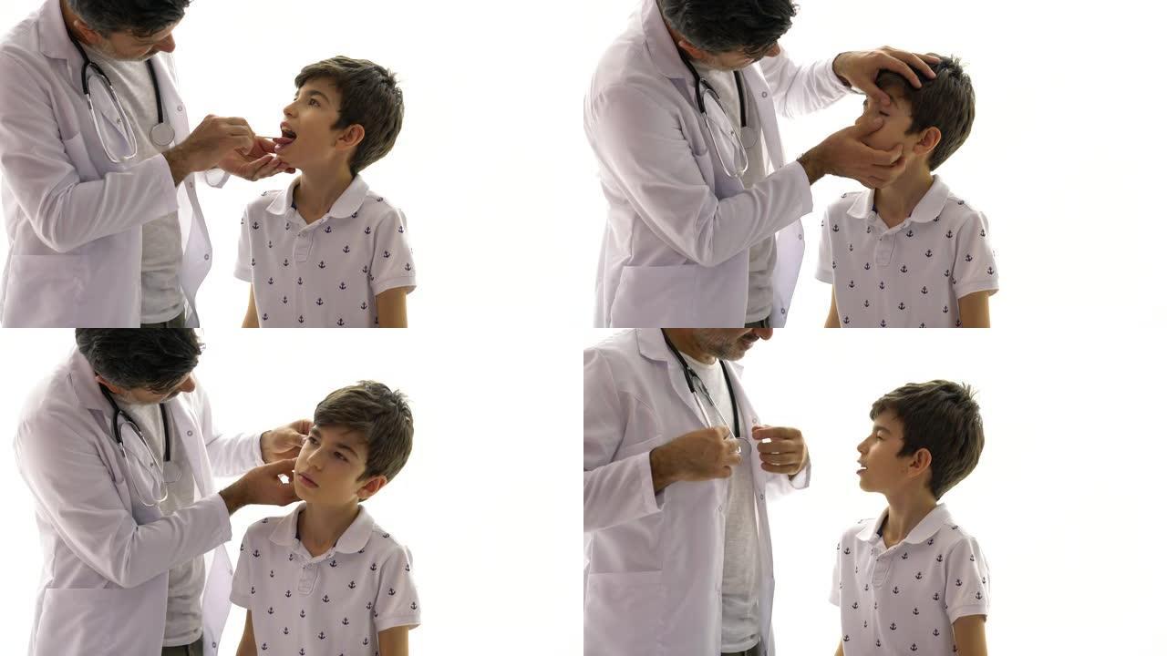 中年儿科医生在医院检查患有压舌板的男孩患者