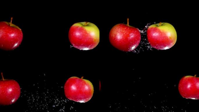 两个湿红苹果相互碰撞