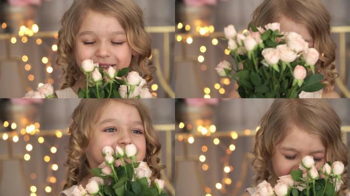 微笑的小女孩肖像的特写镜头拿着一束粉红玫瑰，在金色模糊的花环背景下笑着闻一朵花。