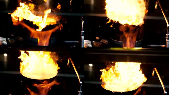 菜。在燃烧的平底锅上烹饪意大利菜