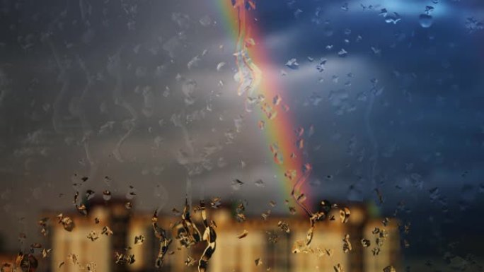 雨中透过窗户在建筑物上方的彩虹