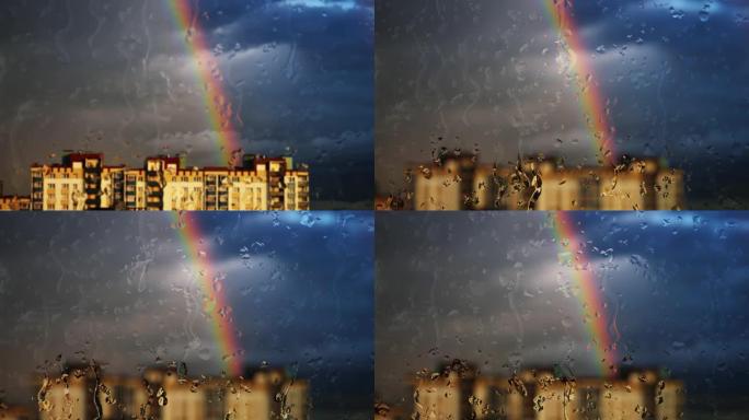 雨中透过窗户在建筑物上方的彩虹
