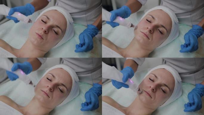 专业美容师在美容诊所执行DermaPen程序