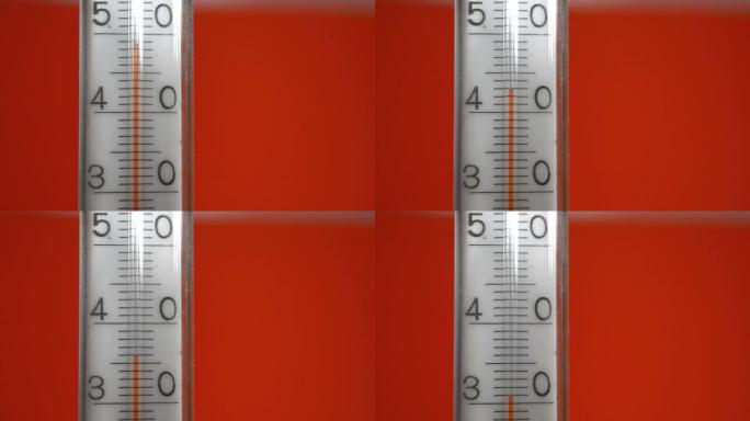 红色背景上的温度计