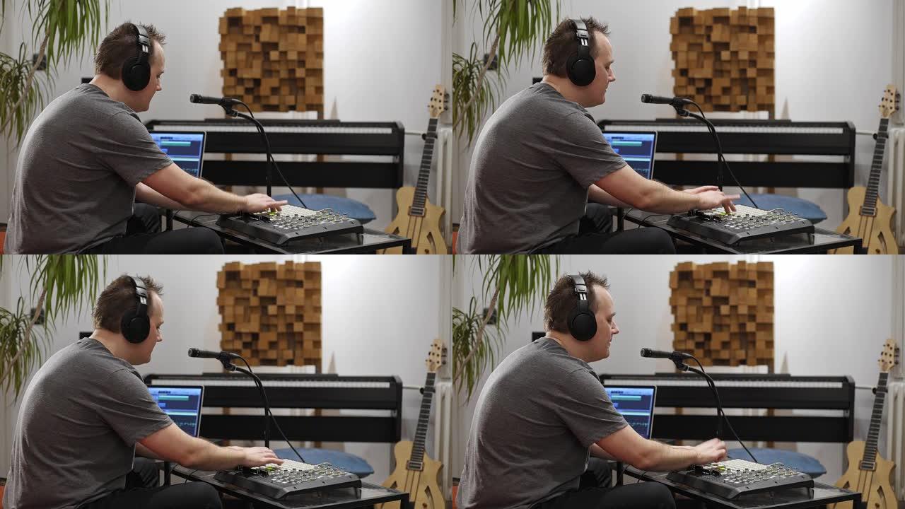 音乐家在家庭音乐工作室演奏midi键盘。