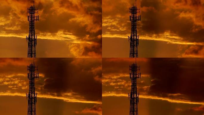 剪影无线电天线与日落的云和冷光通信