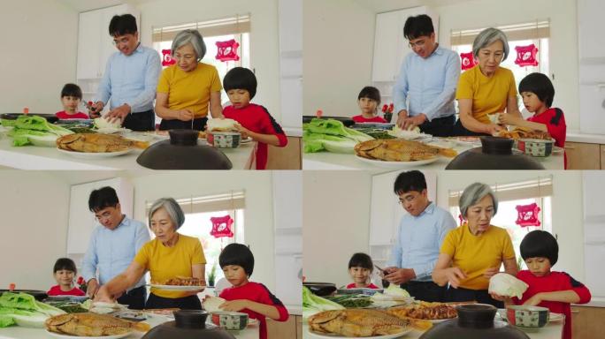 中国一家几代人在厨房里准备新年食物
