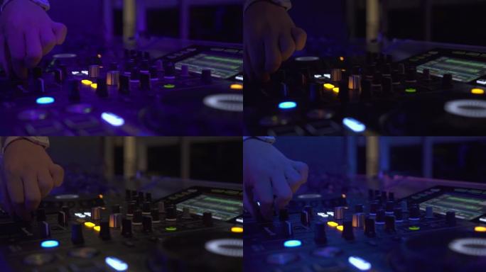 在夜总会派对上关闭DJ甲板和音响控制台，播放家庭音乐。DJ控制器，用于在夜总会混合音乐和彩色灯光。舞