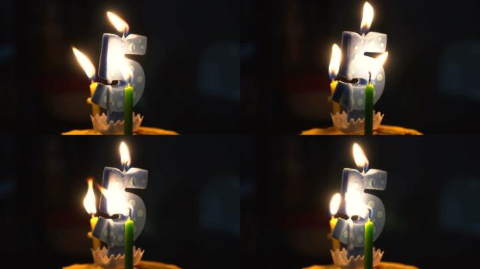 庆祝第五年，在甜蛋糕上燃烧5号蜡烛蜡融化