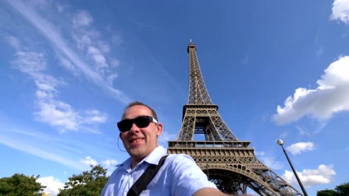 男子在4k慢动作60fps的巴黎埃菲尔铁塔上自拍