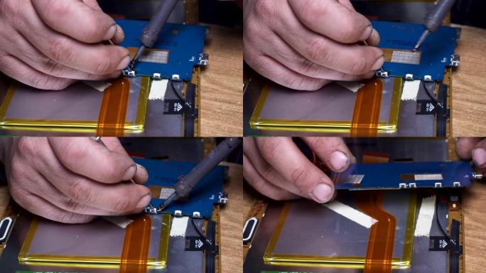 专家非常仔细地焊接和修理损坏的电子设备