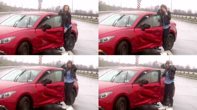 一名妇女在雨中在路上发生事故，她受伤并感到恐惧。