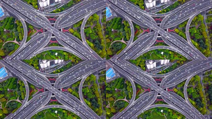 高速公路交叉口鸟瞰图的时间流逝，形状字母x十字。交通概念中的桥梁、有树的道路。中国上海市城市建筑结构