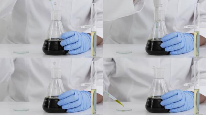 在带有玻璃滴管和一个碗的实验室中使用药物CBD油的科学家的特写