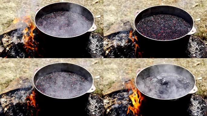 在户外用铁锅做饭。
