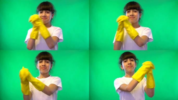 绿色背景上的女孩戴着黄色手套挥舞着双手