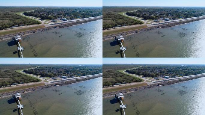 美国路易斯安那州新奥尔良庞恰特雷恩湖畔的码头和铁路。静态摄像机的空中无人机视频。
