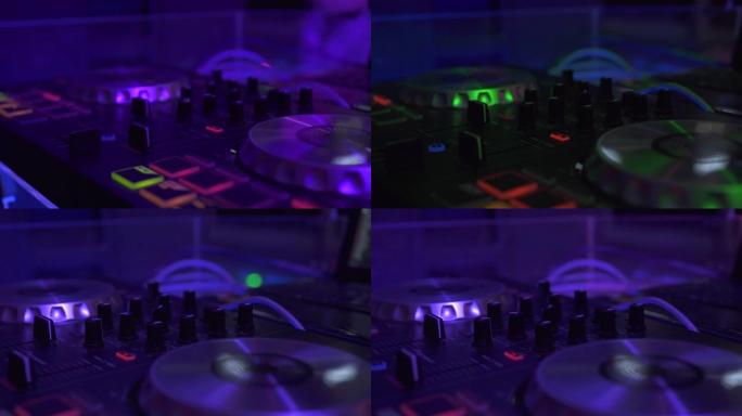 专业dj设备，用于在夜总会混音和录制舞蹈音乐。在夜总会用五颜六色的灯光关闭音乐设备和DJ控制台。夜生