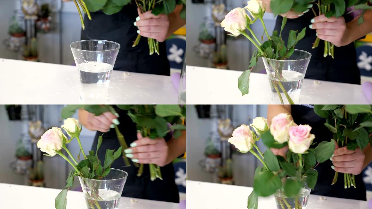 女专业花店把玫瑰放在花店的花瓶上，双手特写。