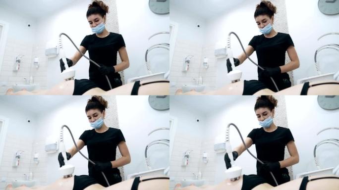 专注于美容师对患者的臀部进行抗脂肪处理，慢动作