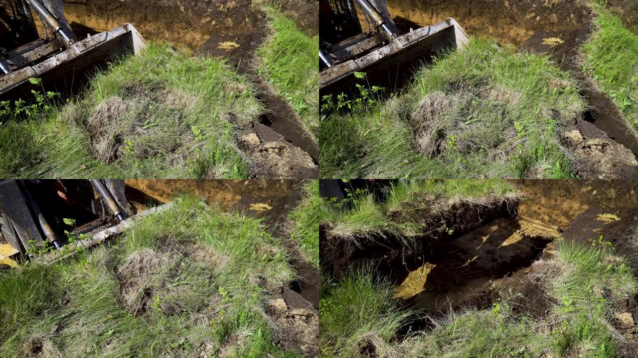 土壤土中小型装载机铲斗挖沟的视图