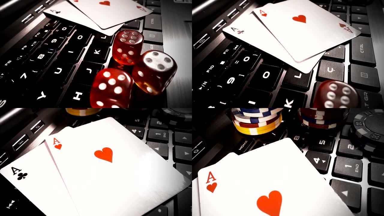 赌博钱筹码扑克牌和笔记本电脑上的骰子