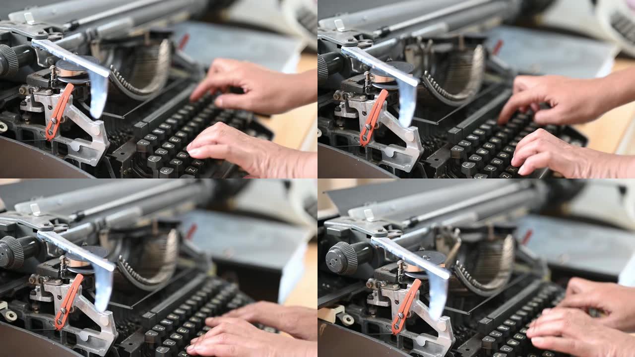 女人在旧打字机用打字机打文字。