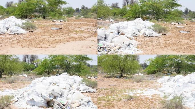 塑料和其他垃圾或垃圾扔在沙漠中引起潜在环境问题的例子。回收是一项正在进行的工作