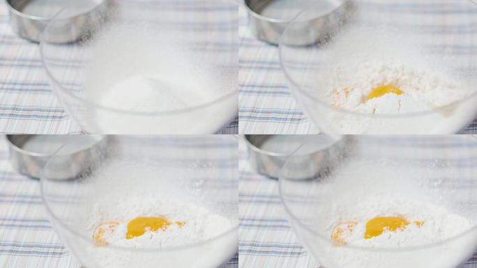 在面包制作过程中，近距离蛋黄落在面粉上的慢动作