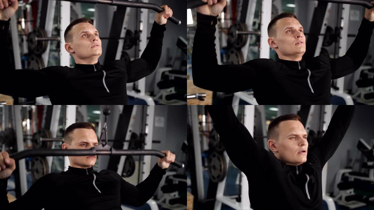 健身房里的人在做举重运动。男性训练手臂肱三头肌肌肉使用电缆机进行体重。锻炼健美运动概念