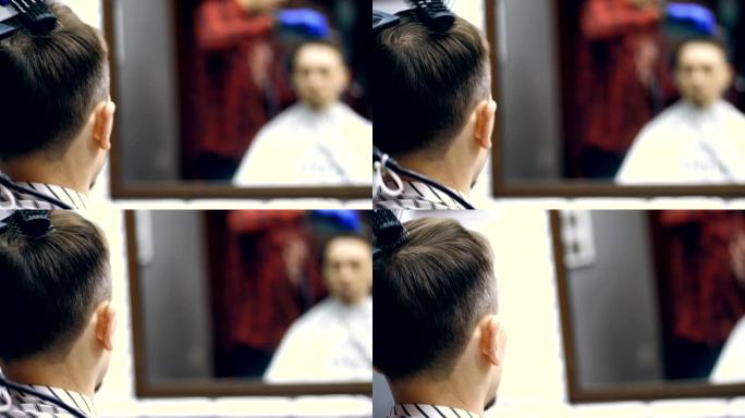 特写，从后面看，在一家baber商店，一家男士发廊，一个男士理发和造型