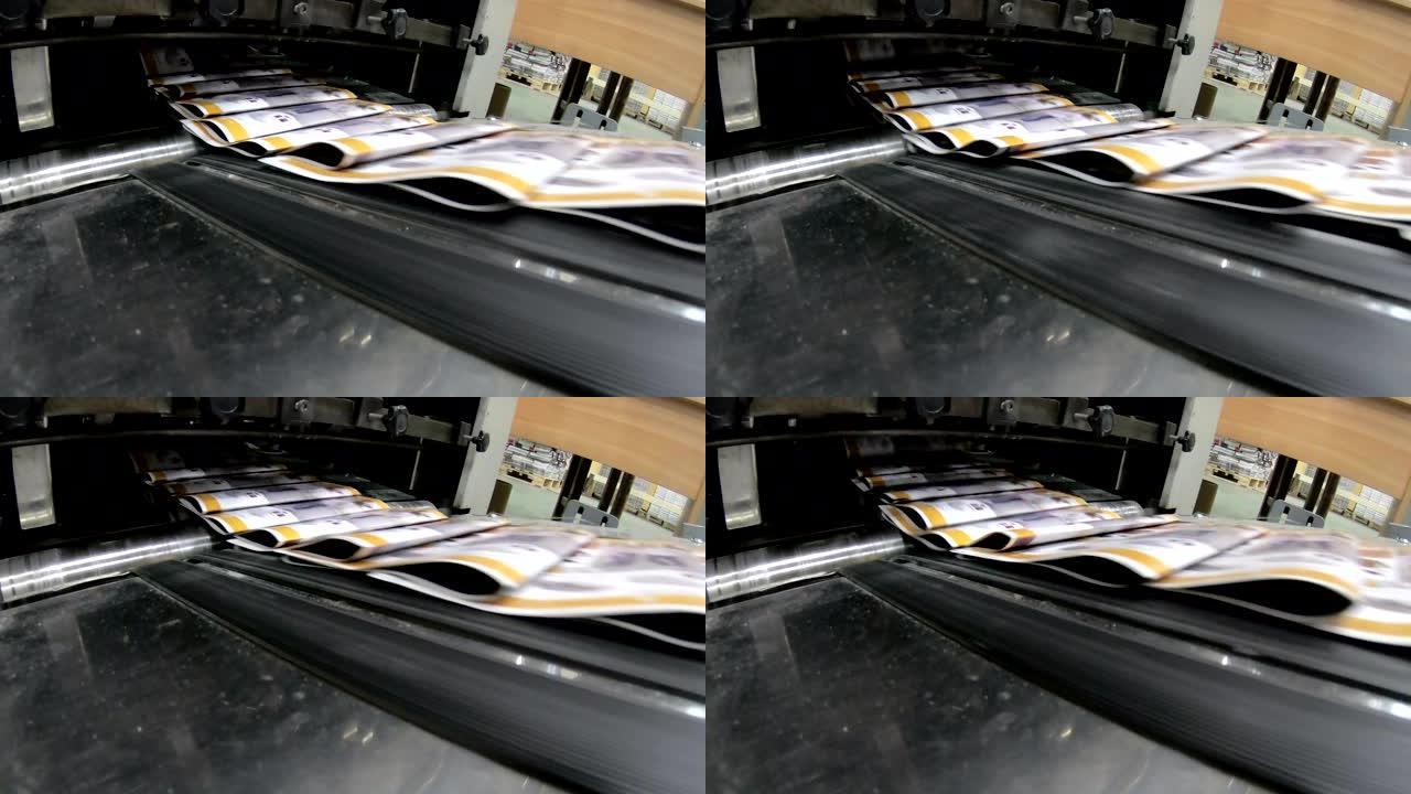 印刷厂工厂，杂志线收集后，将压辊送入印刷单元并折叠
