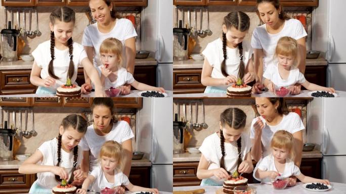 家庭，有两个小女儿的妈妈正在家里的厨房里一起用浆果装饰生日蛋糕。
