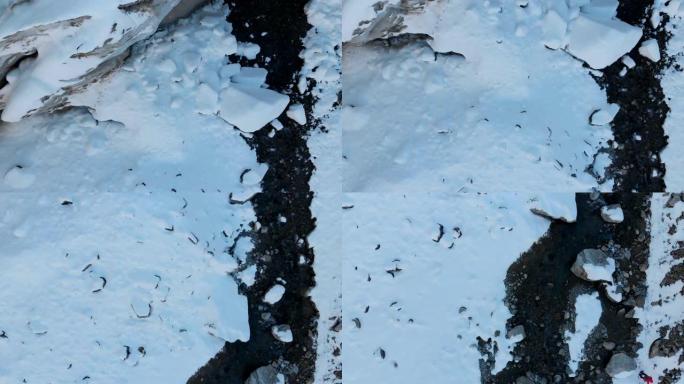 冰川中山河诞生的鸟瞰图。河水从冰窟中流出