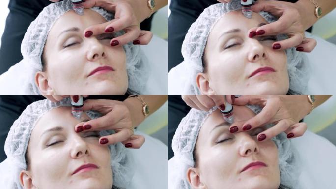 特写美容师用液压剥离装置在病人脸上做程序，慢动作