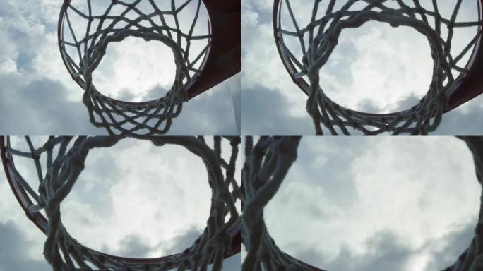 慢动作镜头从篮球网下方向上移动